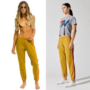 Aviator Nation Gold Track Pants with Rainbow Stripes